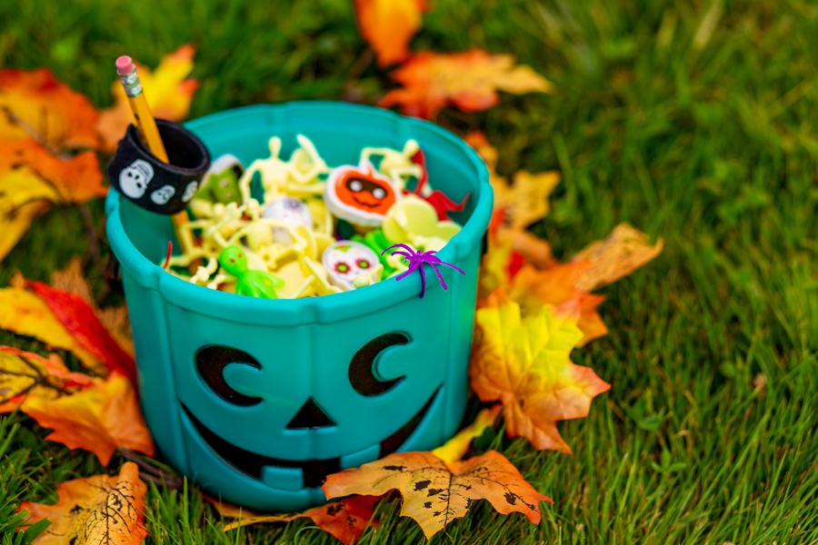 Bucket of halloween candy and toys.