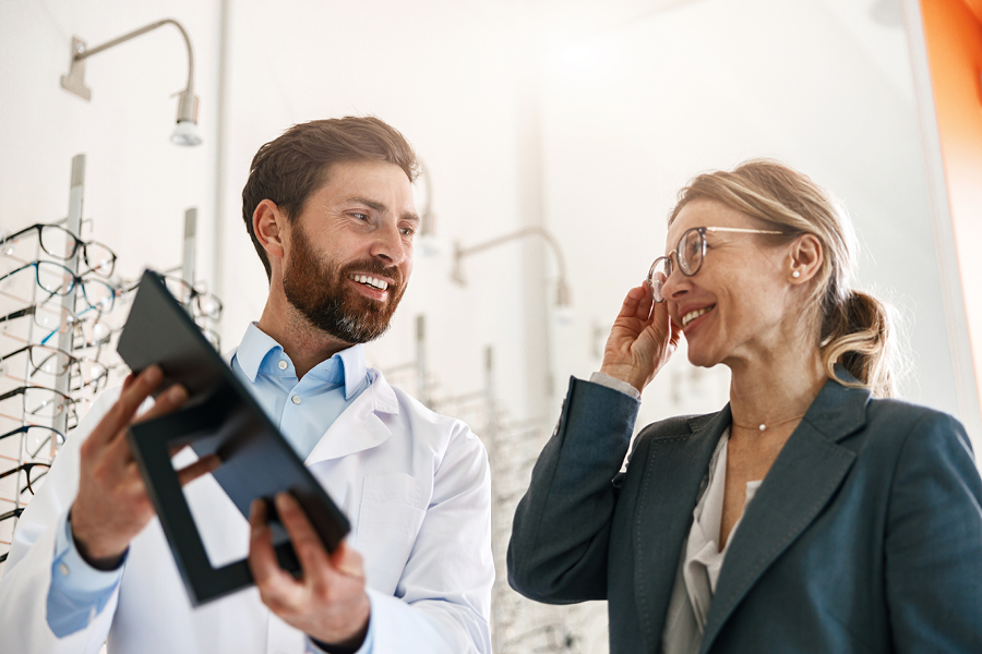 Eye doctor giving a patient a vision exam.