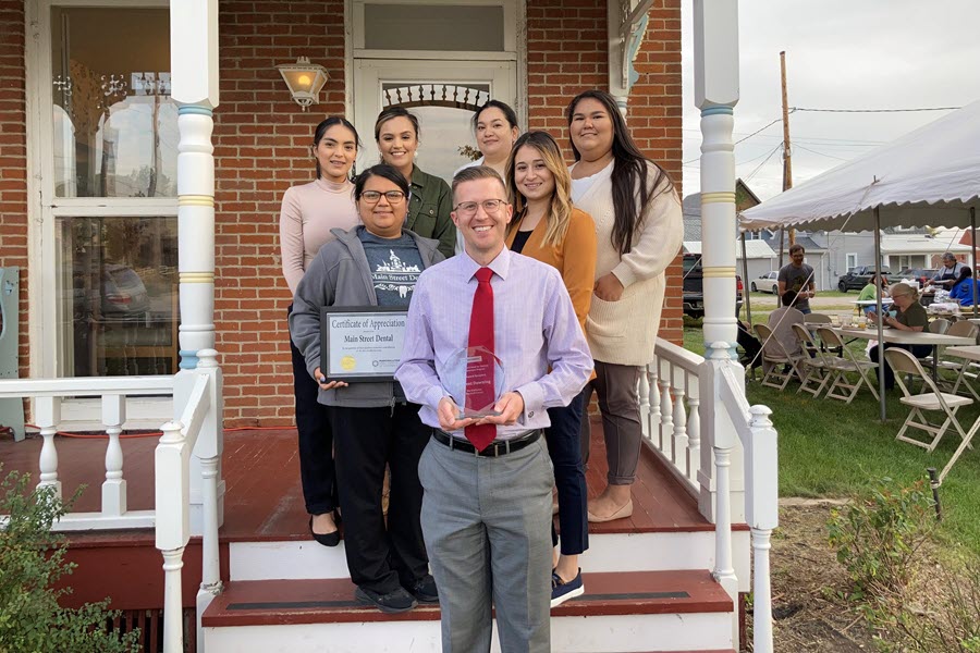 Dr. Downing and staff outside of his dentist office