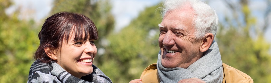 Grandfather and daughter laugh 