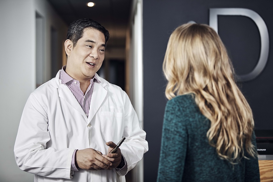 Dentist talking to patient