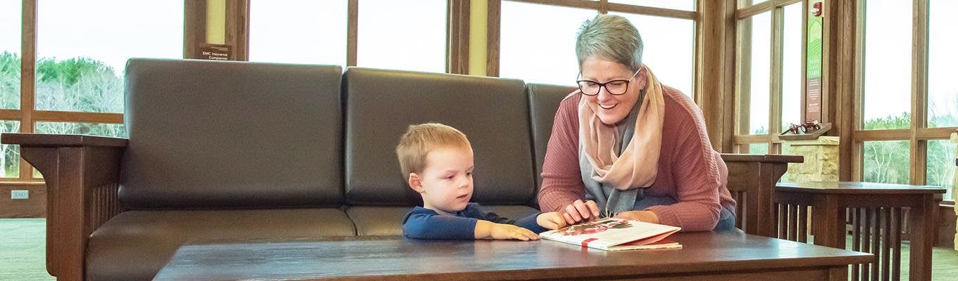 Woman reading to child