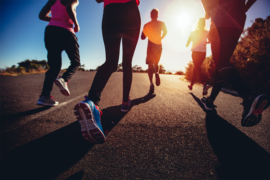 Groupd of runners at sunset